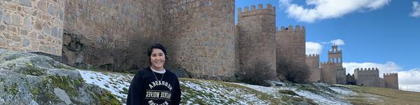 An NWU student in front of the Great Wall of China.