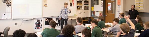 In a high school classroom, an NWU education major student teaches a class. 